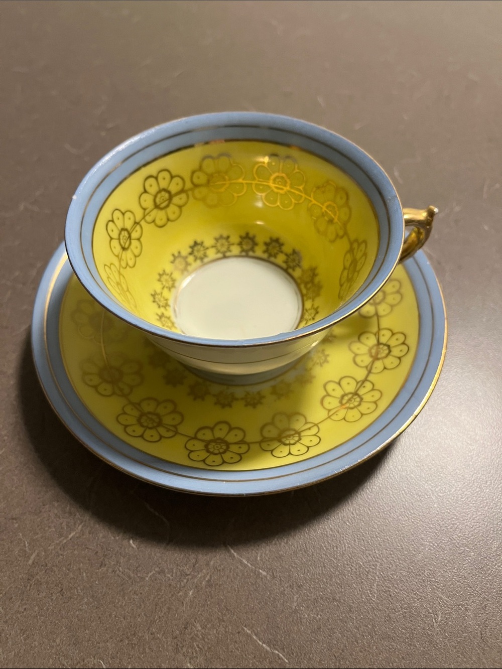Yellow and Blue Floral Porcelain Teacup with Saucer - Elegant Accent
